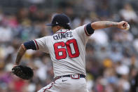 Atlanta Braves starting pitcher Jesse Chavez winds up against the San Diego Padres in the first inning of a baseball game Sunday, Sept. 26, 2021, in San Diego. (AP Photo/Derrick Tuskan)