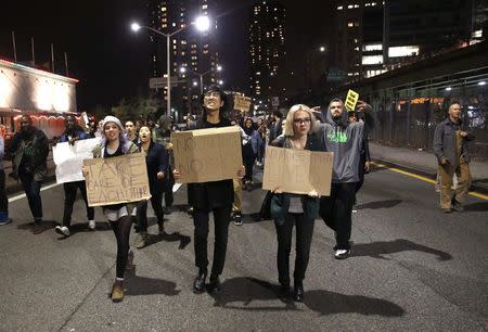 Demonstrators protesting against the verdict announced in the shooting death of Michael Brown in Ferguson, Missouri, march after shutting down the north bound side of the FDR drive in New York November 25, 2014. REUTERS/Shannon Stapleton