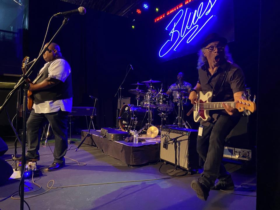 Larry McCray's bass player Jim Alfredson makes a face while playing onstage at The Majestic for the 31st annual Riverfront Blues Society blues fest.