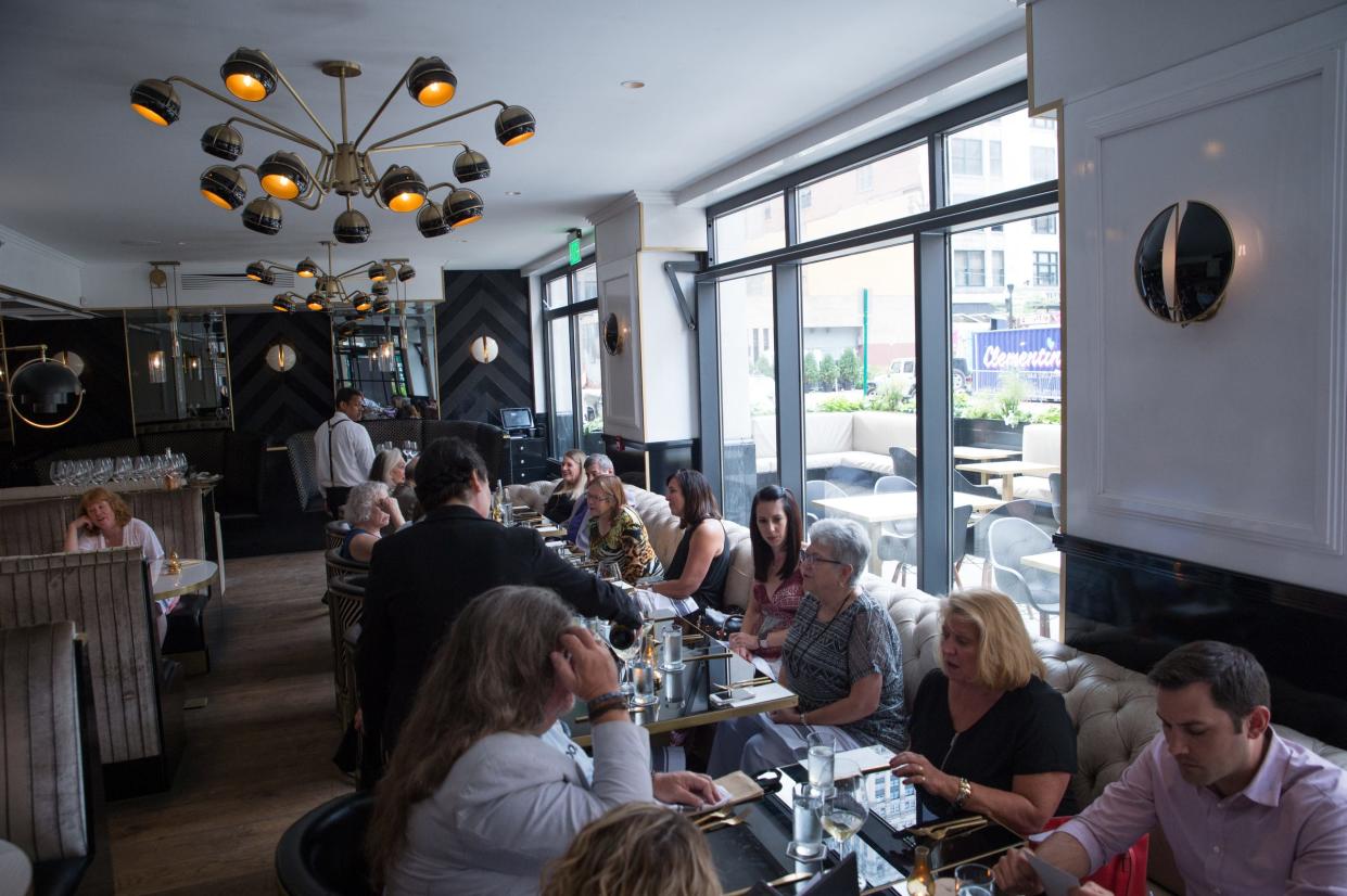 Guests enjoy their food during the Detroit Free Press/Metro Detroit Chevy Dealers Top 10 Takeover at Prime + Proper in downtown Detroit on Aug. 7, 2018.