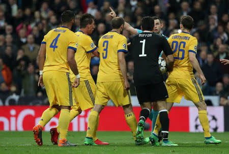 Soccer Football - Champions League Quarter Final Second Leg - Real Madrid vs Juventus - Santiago Bernabeu, Madrid, Spain - April 11, 2018 Juventus' Gianluigi Buffon remonstrates with referee Michael Oliver after being sent off REUTERS/Susana Vera