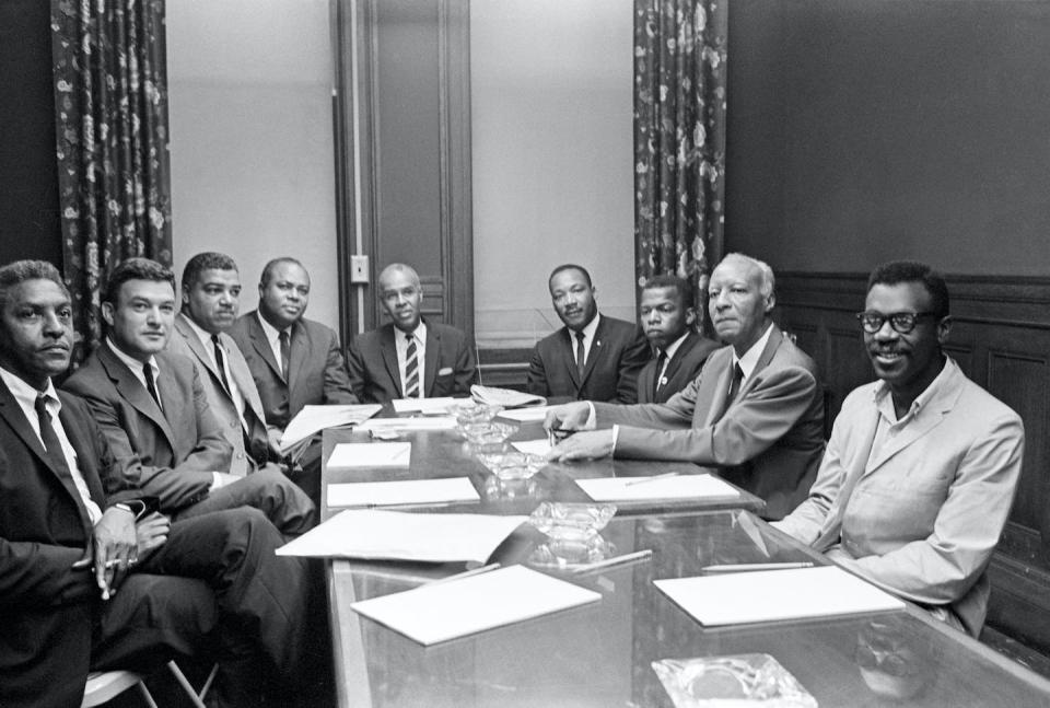 Civil rights leaders, from left, Bayard Rustin, Jack Greenberg, Whitney M. Young Jr., James Farmer, Roy Wilkins, the Rev. Martin Luther King Jr., John Lewis, A. Philip Randolph and Courtland Cox attend NAACP meeting on July 29, 1964. <a href="https://www.gettyimages.com/detail/news-photo/new-york-ny-at-a-meeting-here-in-n-a-a-c-p-headquarters-news-photo/517350918?phrase=bayard%20rustin&adppopup=true" rel="nofollow noopener" target="_blank" data-ylk="slk:Bettmann/GettyImages;elm:context_link;itc:0;sec:content-canvas" class="link ">Bettmann/GettyImages</a>