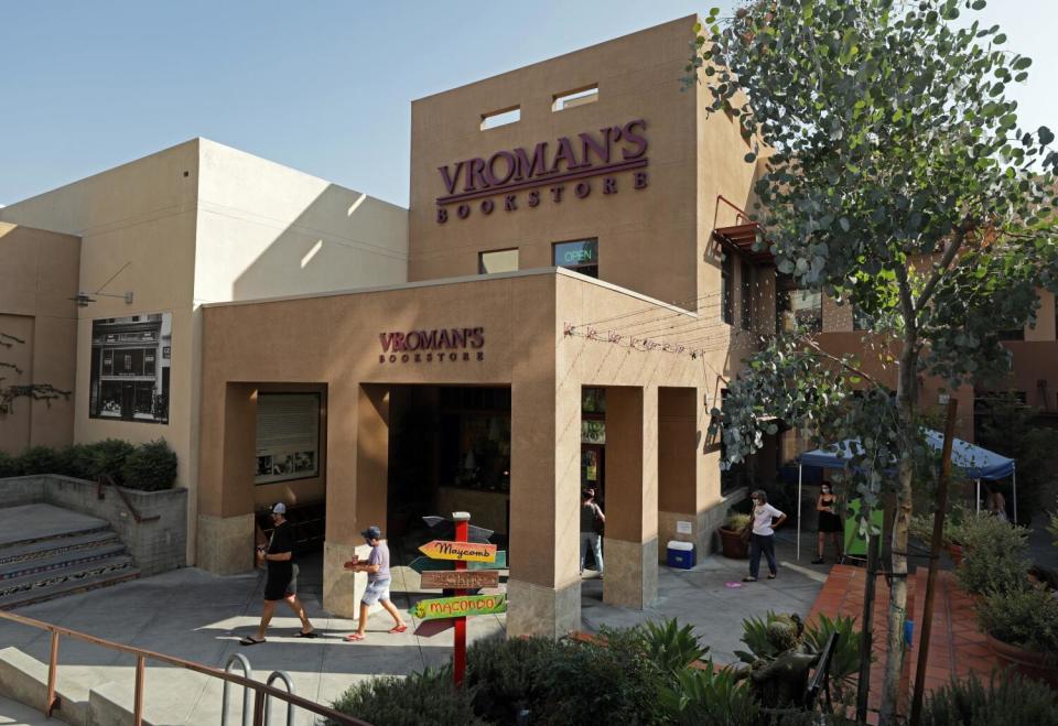 People walk by Vroman's Bookstore in Pasadena