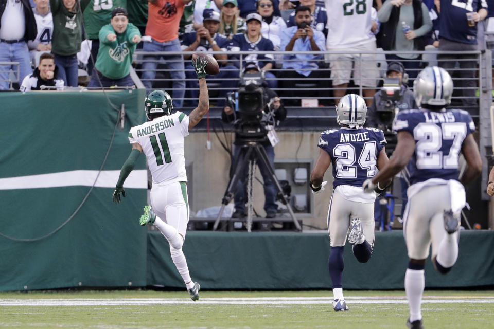 New York Jets' Robby Anderson (11) reacts as he scores a touchdown during the first half of an NFL football game against the Dallas Cowboys, Sunday, Oct. 13, 2019, in East Rutherford, N.J. (AP Photo/Frank Franklin II)