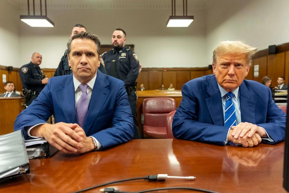 Former US President Donald Trump (R) with his attorney Todd Blanche (POOL/AFP via Getty Images)