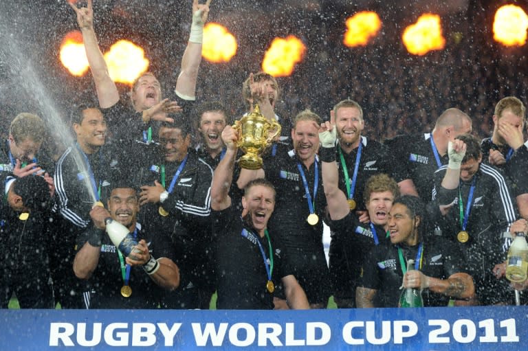 New Zealand's All Blacks celebrate their 2011 Rugby World Cup final win against France at Eden Park Stadium in Auckland