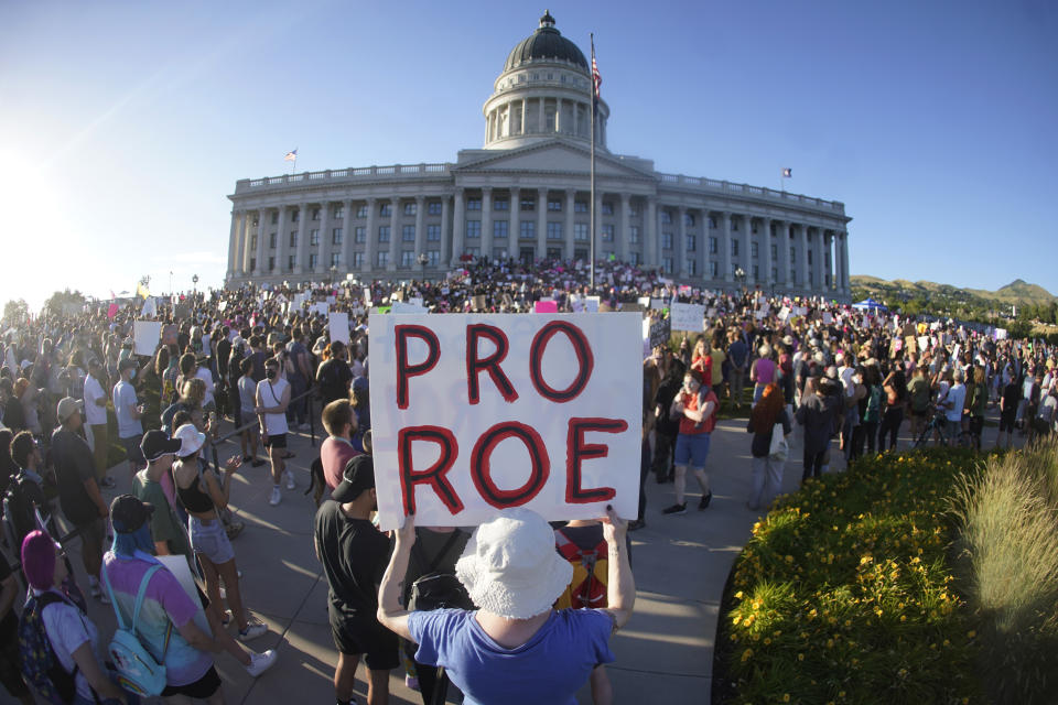 FILE - People attend an abortion-rights rally at the Utah State Capitol in Salt Lake City after the U.S. Supreme Court overturned Roe v. Wade, June 24, 2022. State courts in Utah and Kansas are planning to hear arguments Tuesday, Aug. 8, 2023, in legal challenges involving new abortion laws since the overturning of Roe v. Wade. (AP Photo/Rick Bowmer, File)