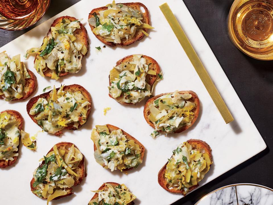 Cheesy Crab Artichoke Toasts