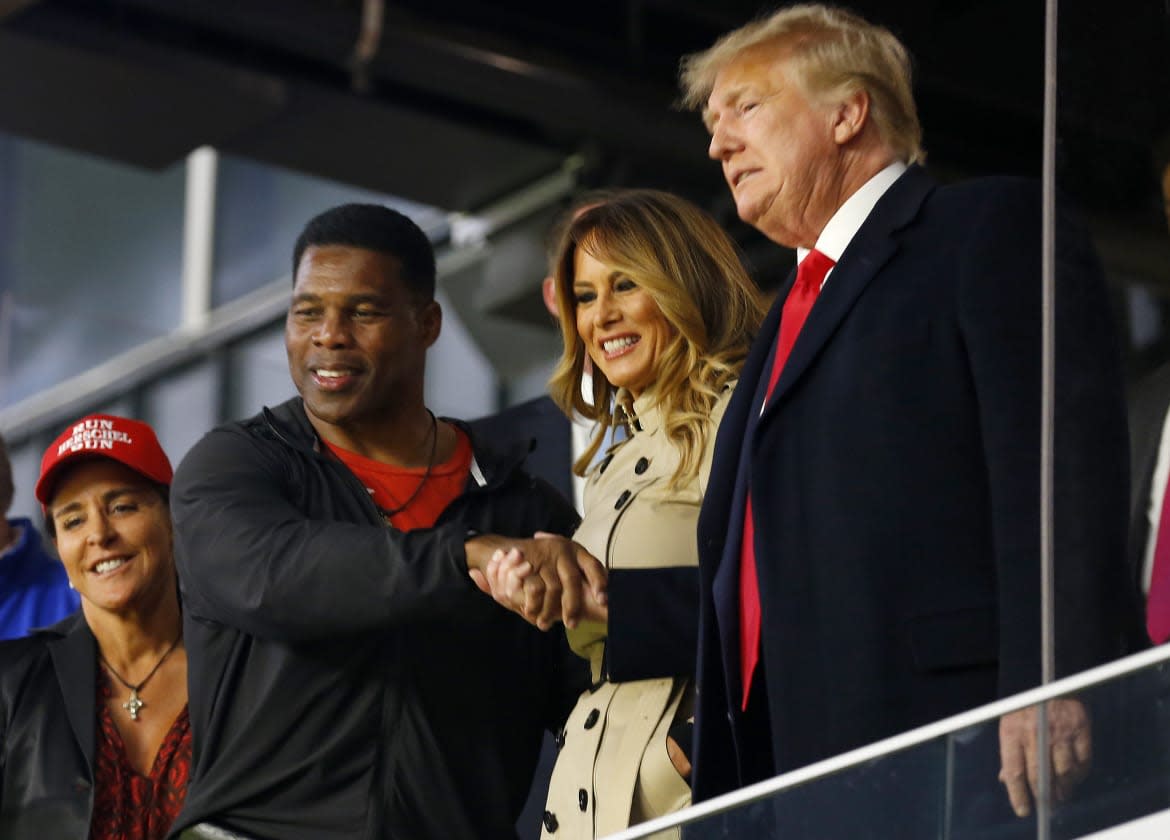 <div class="inline-image__caption"><p>His campaign says Herschel Walker, seen here with Donald and Melania Trump at the 2021 World Series, is not “hiding” the 10-year-old boy he has never publicly acknowledged as his son.</p></div> <div class="inline-image__credit">Michael Zarrilli/Getty</div>