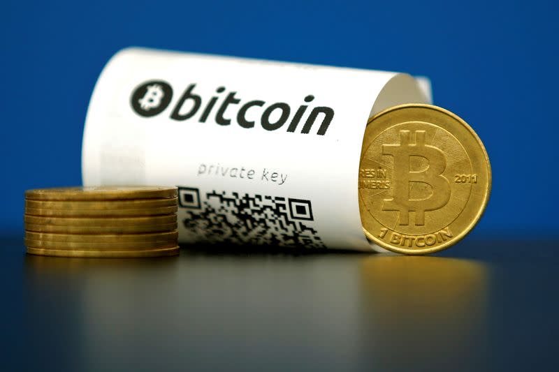 FILE PHOTO: An illustration photo shows a Bitcoin (virtual currency) paper wallet with QR codes and a coin are seen at La Maison du Bitcoin in Paris