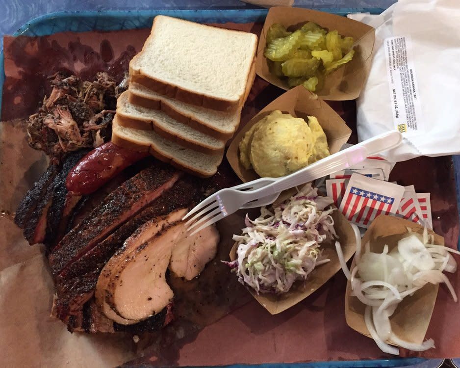 pork ribs, turkey, pulled pork, sausage, and brisket at Franklin Barbecue in Austin, TX