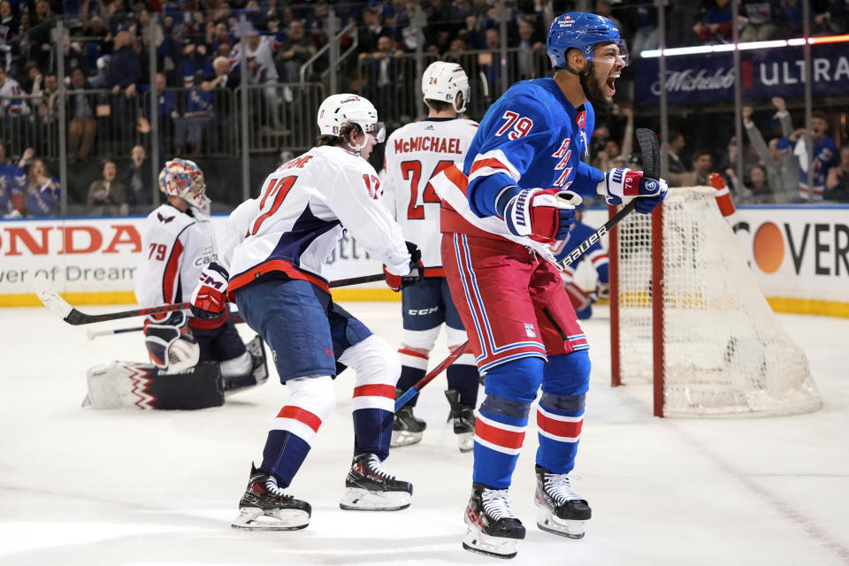 New York Rangers' K'Andre Miller (79) celebrates after shooting the puck past Washington Capitals goaltender Charlie Lindgren (79) for a goal during the second period in Game 2 of an NHL hockey Stanley Cup first-round playoff series, Tuesday, April 23, 2024, in New York. (AP Photo/Frank Franklin II)