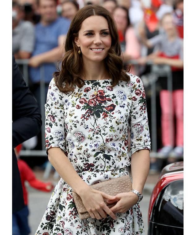 Kate looked elegant in a floral top and skirt combo for day two of their Polish visit. Photo: Getty