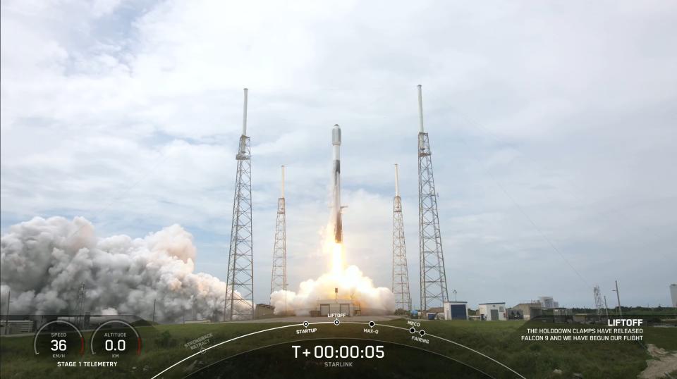 a rocket lifts off under cloudy skies