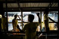 Inmate Mario Dimaculangan (C) is the longest serving inmate at Quezon City Jail after being charged with killing a politician's relative in 2001