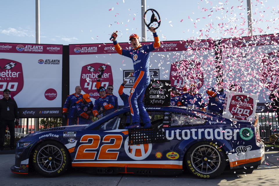 Joey Logano celebrates in Victory Lane after winning the NASCAR Cup Series auto race at Atlanta Motor Speedway, Sunday, March 19, 2023, in Hampton, Ga. (AP Photo/Butch Dill)