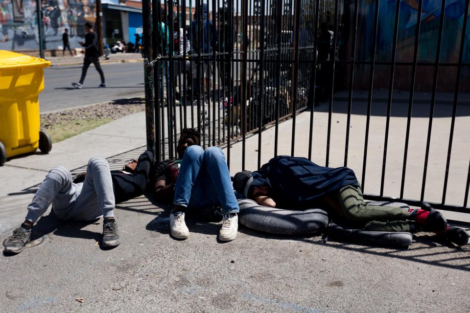 Venezuelan migrants are staying in front and across the street of Sacred Heart Church, on Wednesday, April 26, 2023, after crossing into the U.S.