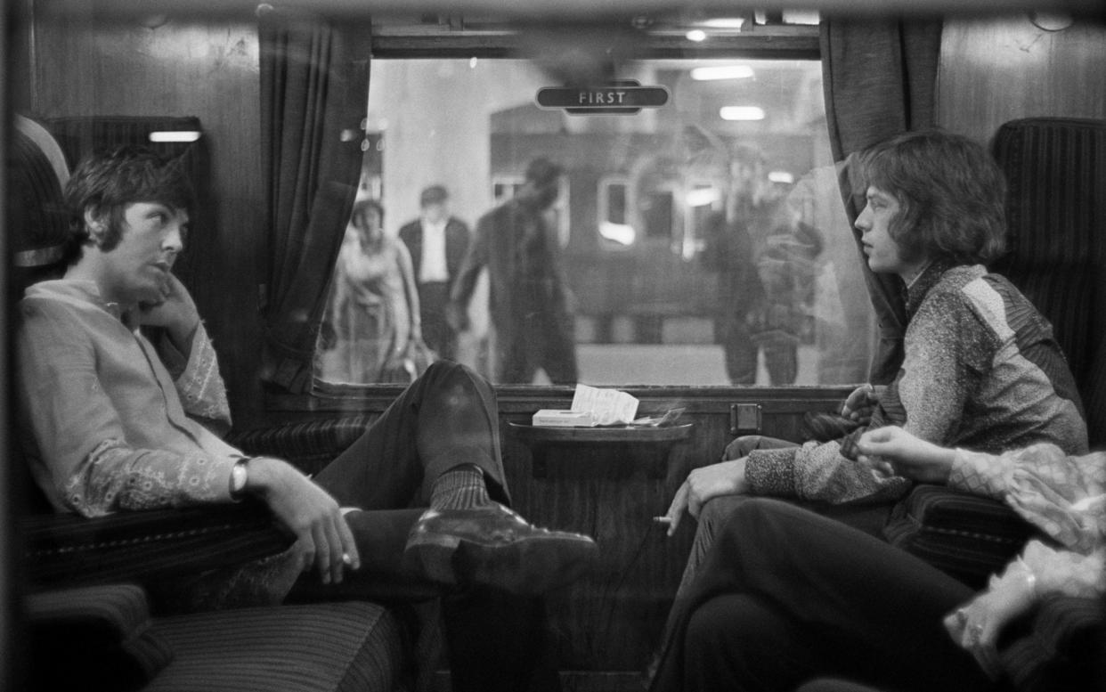 Fellow travellers: Paul McCartney and Mick Jagger share a train carriage in 1967 - Getty