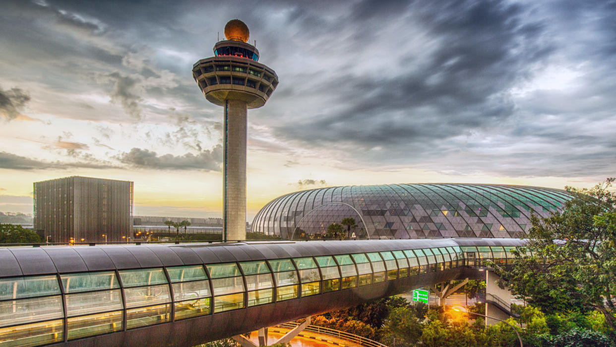 Singapore Changi Airport control tower at dusk.