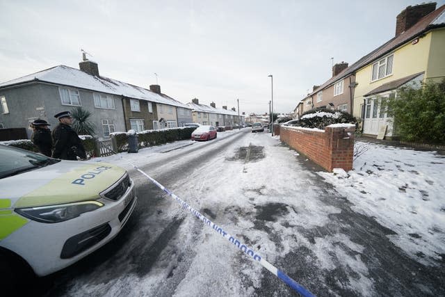 Police officers in Cornwallis Road, Dagenham, east London, where the bodies of two boys were found