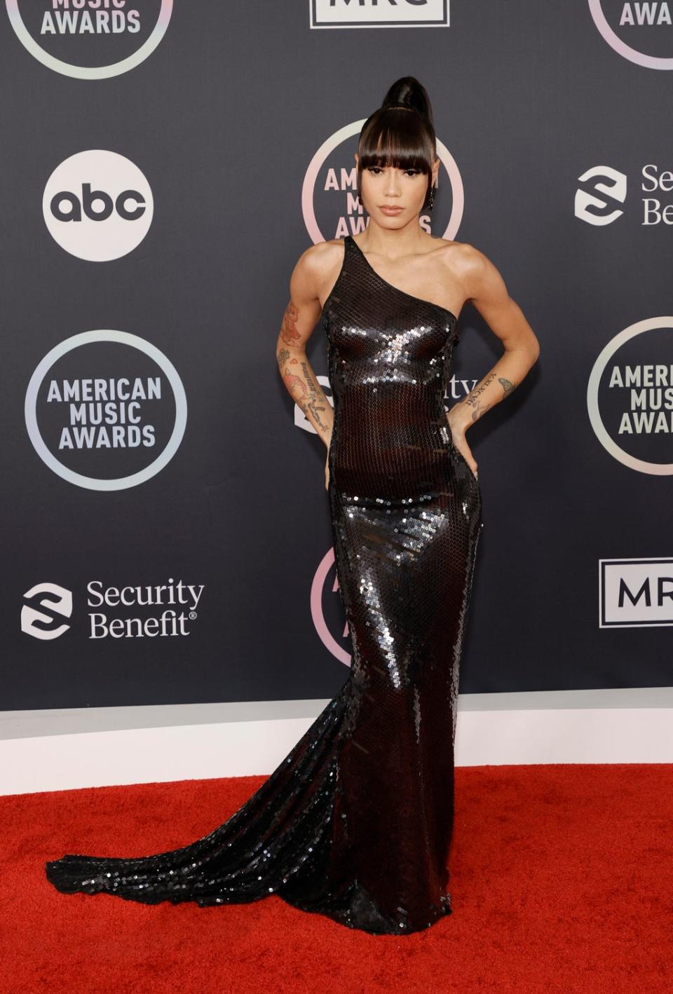 Coi Leray wears a black gown on the AMAs red carpet (Getty Images)