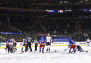 Washington Capitals and New York Rangers fight in the opening seconds of an NHL hockey game Wednesday, May 5, 2021, in New York. (Bruce Bennett/Pool Photo via AP)