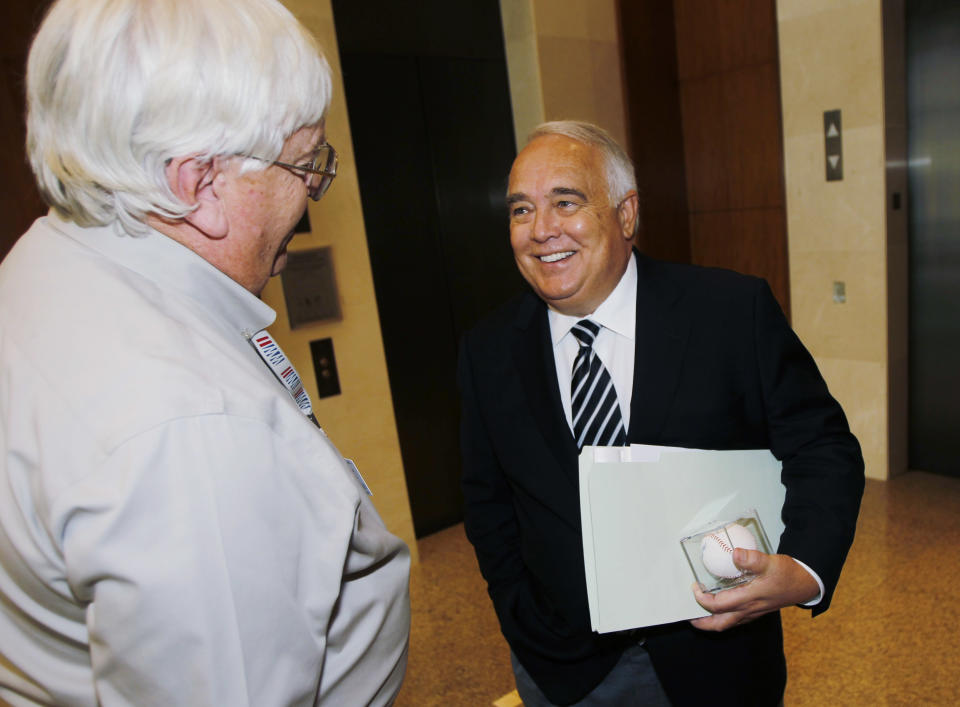 Ron Fowler, right, jokes with a reporter after the announcement of the approval of the sale of the San Diego Padres to a ownership group headed by Fowler and members of the O'Malley family of Los Angeles Dodgers fame during a meeting of baseball owners in Denver on Thursday, Aug. 16, 2012. Fowler, the chief executive of Liquid Investments, will become the controlling owner of the franchise if the purchase price of around $800 million is accepted by current Padres owner John Moores. (AP Photo/David Zalubowski)