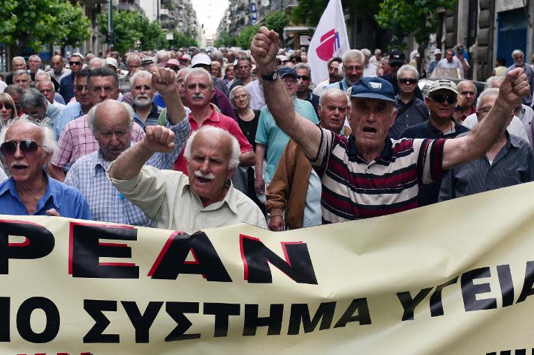 Pensioners march towards the Ministry of Health in Athens during a 24-hour strike by health workers and doctors on May 20, 2015