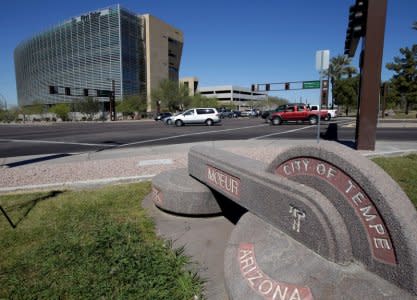 Traffic passes an intersection just north of the location where a woman pedestrian was struck and killed by an Uber self-driving sport utility vehicle in Tempe, Arizona, U.S., March 19, 2018.    REUTERS/Rick Scuteri