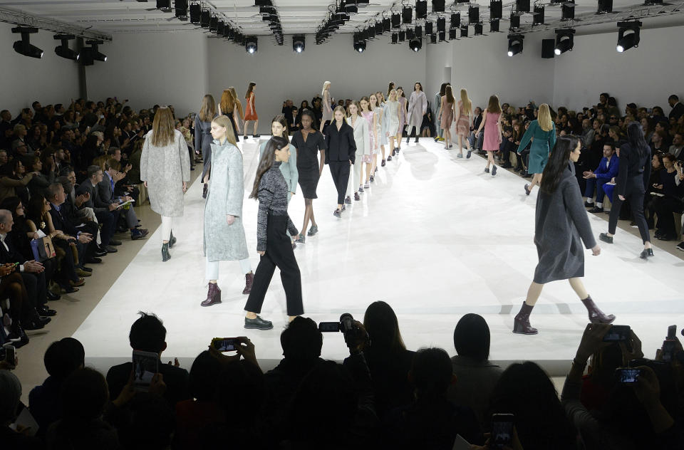Models wear creations for Jil Sander women's Fall-Winter 2014-15 collection, part of the Milan Fashion Week, unveiled in Milan, Italy, Friday, Feb.21, 2014. (AP Photo/Giuseppe Aresu)