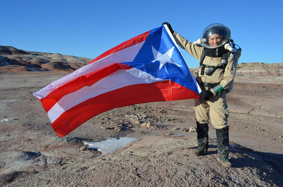 Dr. Yajaira Sierra-Sastre holding a the Puerto Rican flag. (<a href="http://hi-seas.org/">Dr. Sian Proctor</a>)