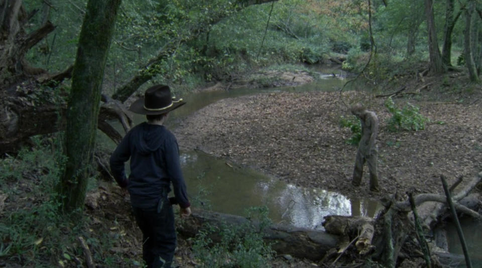 <p>In a bored and bratty mood, Carl swiped Daryl’s gun and went off into the woods, where he found a walker stuck in mud. He threw rocks at it and got closer so he could shoot it, but when it got partially free and moved closer to him, he panicked, dropped the gun, and ran back to Hershel’s farm. Not only did he leave the walker alive (well, undead), but he also didn’t tell anyone about it … leaving it free to sneak up on Dale and kill him later in the episode.<br><br>(Photo: AMC) </p>