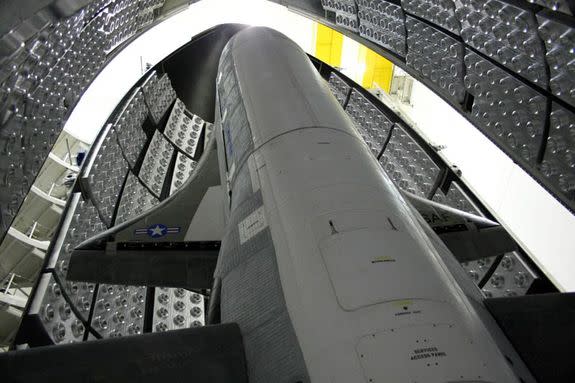 The U.S. Air Force's X-37B Orbital Test Vehicle is shown inside its payload fairing during encapsulation at the Astrotech facility in Titusville, Fla., ahead of a planned April 2010 launch from Cape Canaveral Air Force Station in Florida.