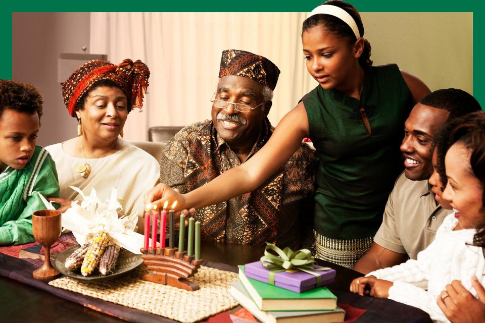 Multi-generation family lighting Kwanzaa candles