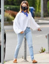 <p>Ashley Tisdale hits the streets of L.A. on Wednesday in an oversized white sweater, jeans and mules.</p>