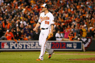 Darren O'Day #56 of the Baltimore Orioles reacts after he struck out Alex Rodriguez #13 of the New York Yankees to end the top of the seventh inning during Game One of the American League Division Series at Oriole Park at Camden Yards on October 7, 2012 in Baltimore, Maryland. (Photo by Rob Carr/Getty Images)