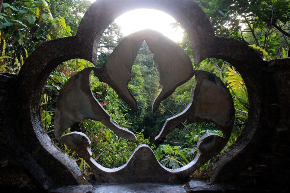 This Jan. 31, 2014 photo shows trees framed through a concrete philodendron sculpture at Las Pozas, a dreamy, little-known garden of surreal art, in Mexico’s northeast jungle. Las Pozas is located on a 100-acre (40-hectare) hillside where the Sierra Madre mountains and coastal plains of the northeast state of San Luis Potosi meet. (AP Photo/Teresa de Miguel Escribano)