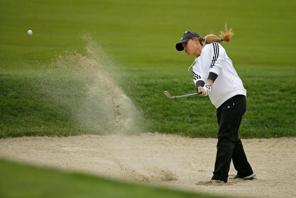 Westlake High graduate Danielle Kang hits out of bunker up to the 10th green during the first round of the LPGA Mediheal Championship on April 26, 2018, in Daly City, Calif.