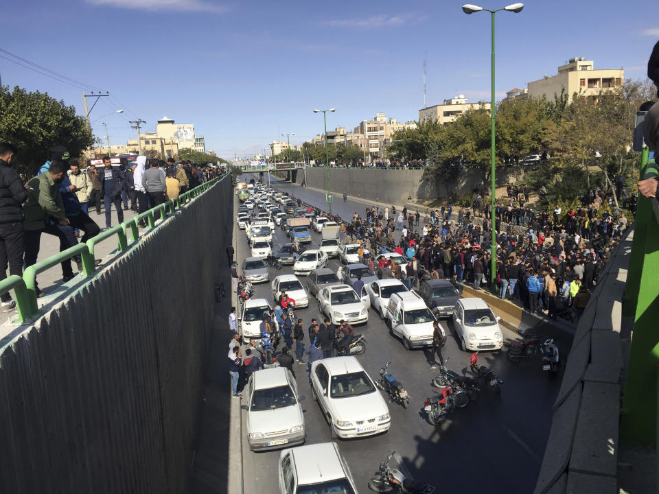 Cars block a street during a protest against a rise in gasoline prices, in the central city of Isfahan, Iran, Saturday, Nov. 16, 2019. Demonstrators angered by a 50% increase in government-set gasoline prices blocked traffic in major cities and occasionally clashed with police Saturday after a night of demonstrations punctuated by gunfire. (AP Photo)