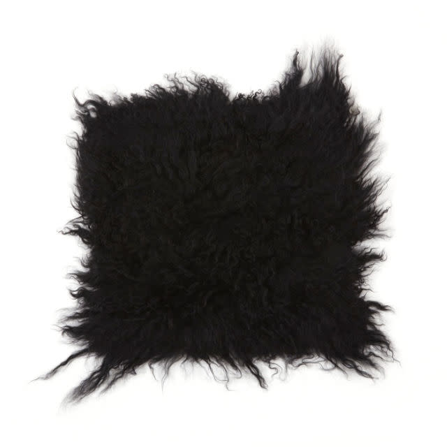 <p>Tibetan Sheep Chair Pad, $48, <a rel="nofollow noopener" href="http://goodhoodstore.com/store/broste-tibetan-sheep-cushion-lamb-black-26705" target="_blank" data-ylk="slk:goodhoodstore.com;elm:context_link;itc:0;sec:content-canvas" class="link "><u>goodhoodstore.com</u></a>.</p>