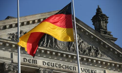 Bundestag Prepares Seating For New Political Constellation<br>BERLIN, GERMANY - OCTOBER 17: A German flag flies near the inscription: 