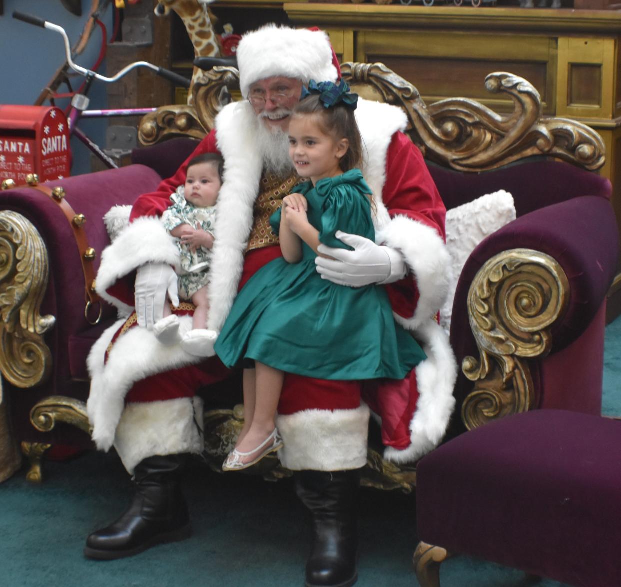 Colette Dignazio, 3, and her 3-month-old sister Charlotte visit Santa Claus at the Cherry Hill Mall on Nov. 17, 2023.