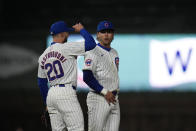 Chicago Cubs third baseman Miles Mastrobuoni, left, and second baseman Nico Hoerner baseball game celebrate their team's 12-2 win over the Colorado Rockies, Tuesday, April 2, 2024, in Chicago. (AP Photo/Erin Hooley)