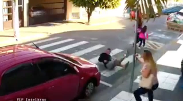 The off-duty police officer draws her gun and knocks the man down. Source: Ferreira Master