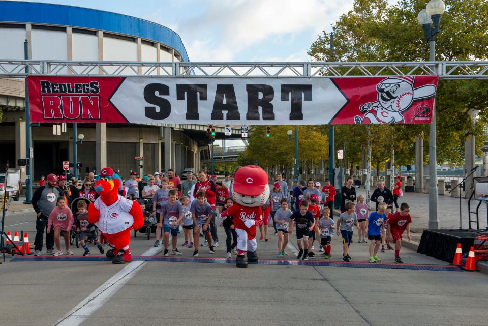 The Redlegs Run takes place Saturday to raise funds for the Reds Community Fund. It features a 5K and 10K run/walk, a one-mile run and for the kids ages 10 and under, Gapper's Kids Fun Run. Pictured: The start of the One Mile Family Walk and Run in 2021.