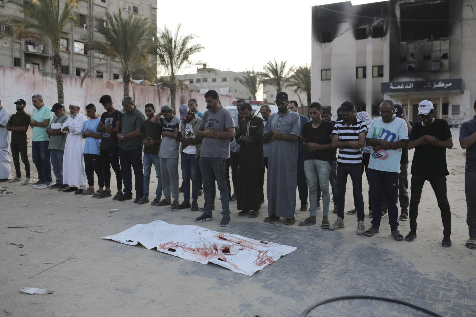 Palestinians pray for a victim of Israeli bombardment before their burial in Khan Younis, southern Gaza Strip, Friday, June 21, 2024. (AP Photo /Jehad Alshrafi)