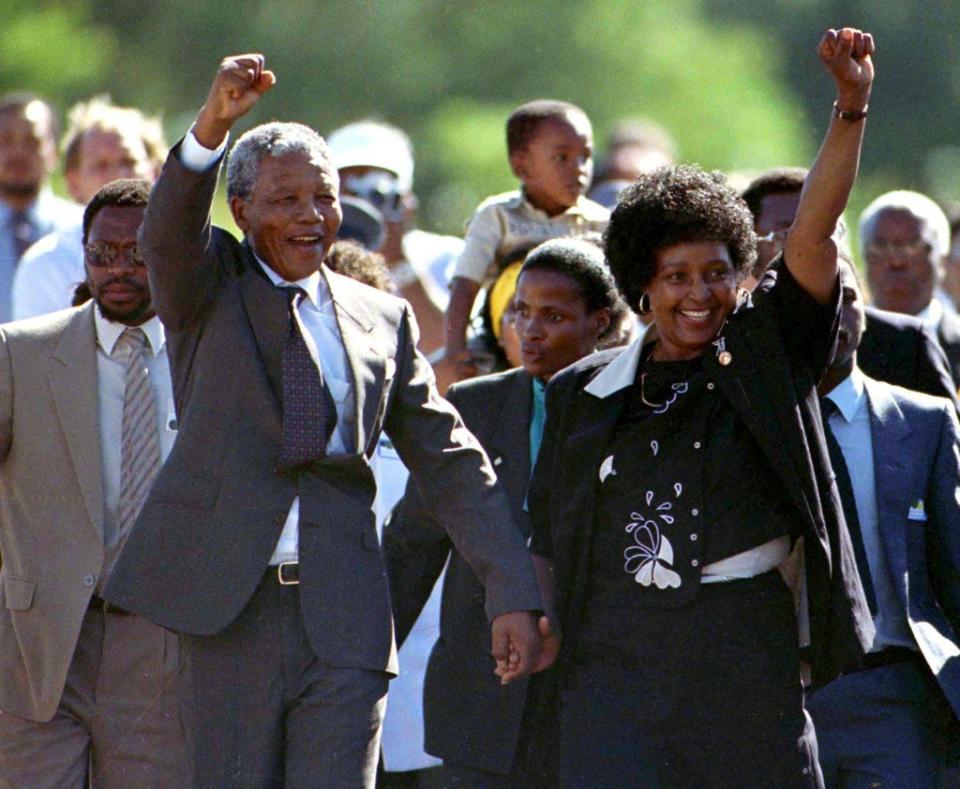 Nelson Mandela accompanied by his wife Winnie walks out of the Victor Verster prison, near Cape Town, on February 11, 1990, after spending 27 years in apartheid jails (Reuters)