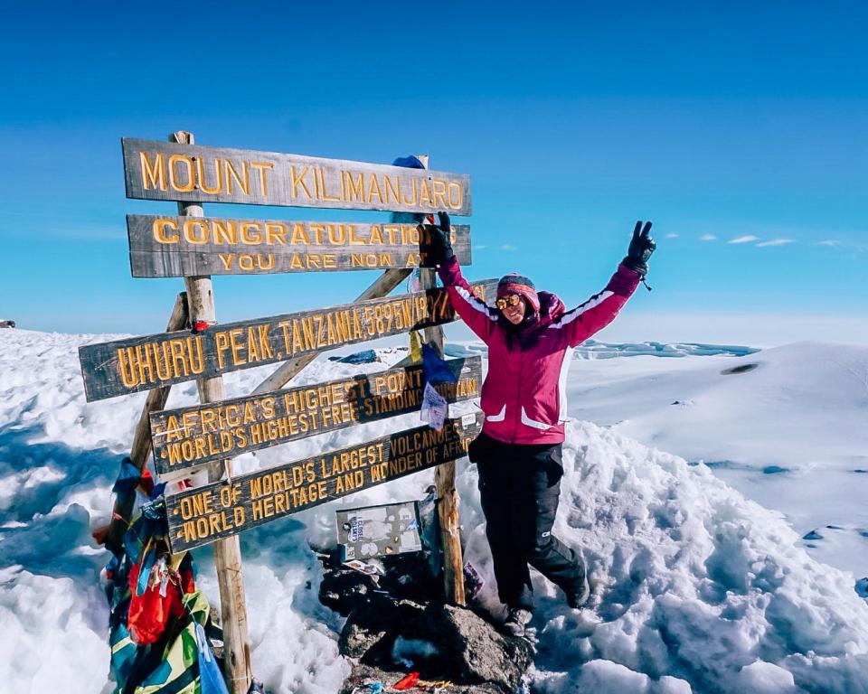 Kate Boardman at the summit of Mt. Kilimanjaro.