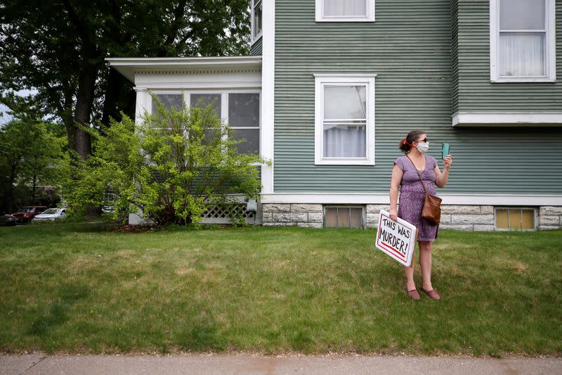 Protesters gather at the scene where Floyd was pinned down by a police officer in Minneapolis