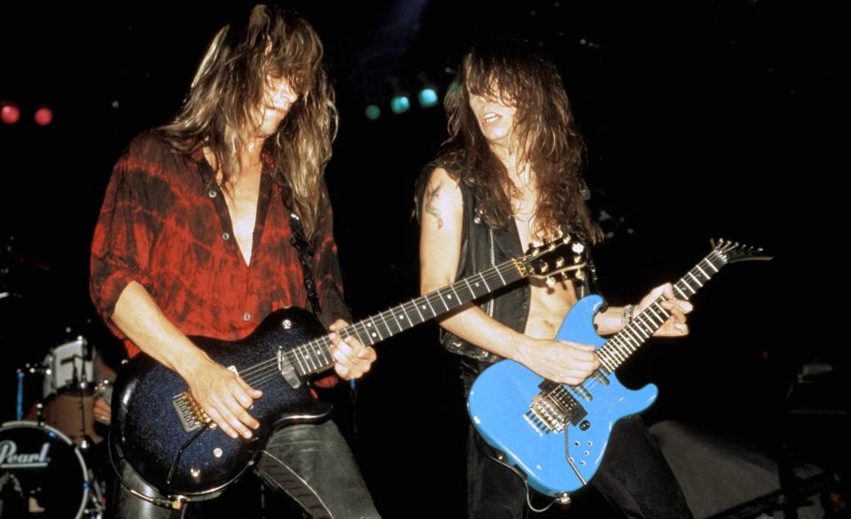 Scotti Hill (left) and Snake Sabo perform onstage with Skid Row